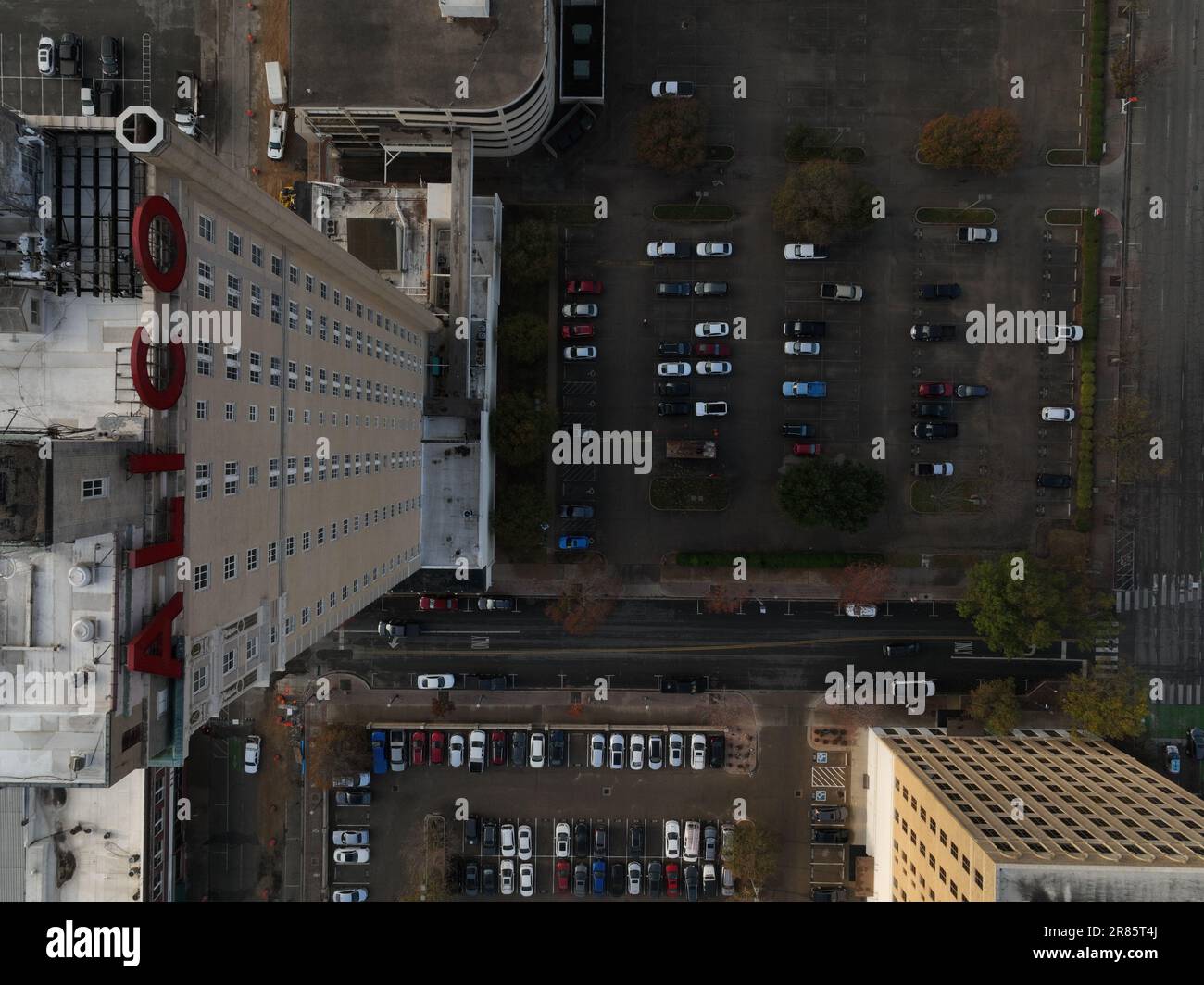 A street scene featuring cars parked in front of the Alico Building in ...