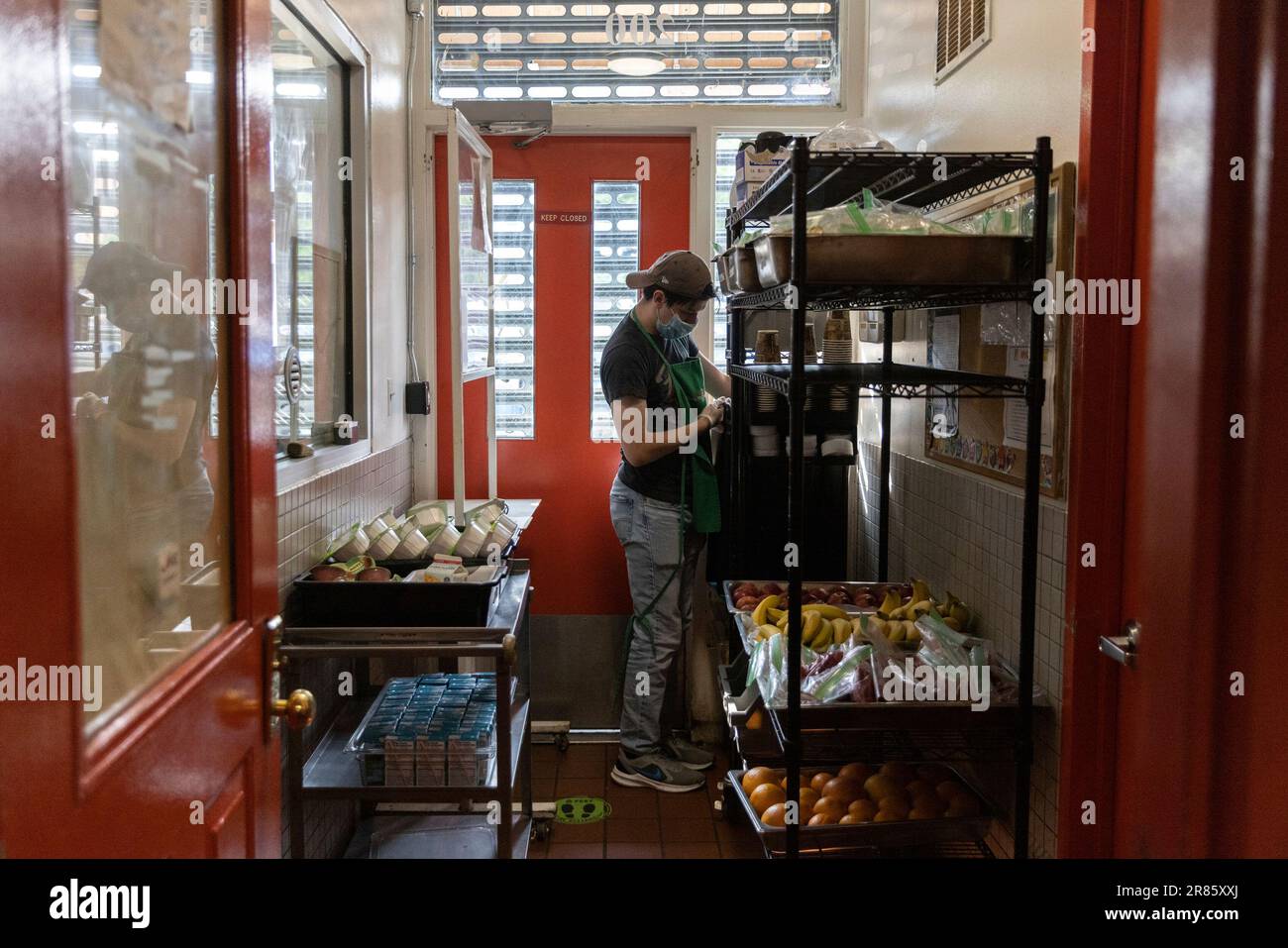 Nicholas Loud organizes breakfast meals prepared at CHiPS, a soup kitchen and food pantry, on