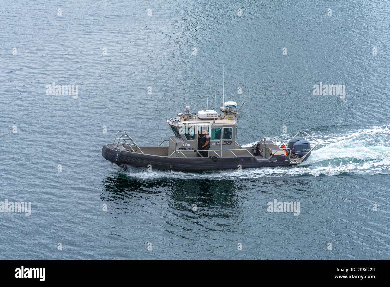 San Pedro, CA, USA – June 2, 2023: A Los Angeles Port Police boat speeds on the water at the Port of Los Angeles in San Pedro, California. Stock Photo