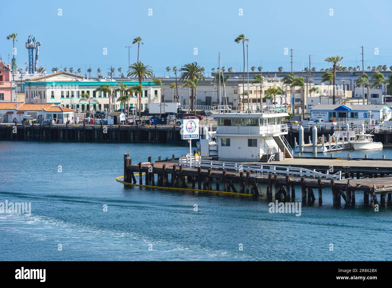 San Pedro, CA, USA – June 2, 2023: Wooden pier dock and building for Jankovich fuel dock business in in San Pedro, California. Stock Photo