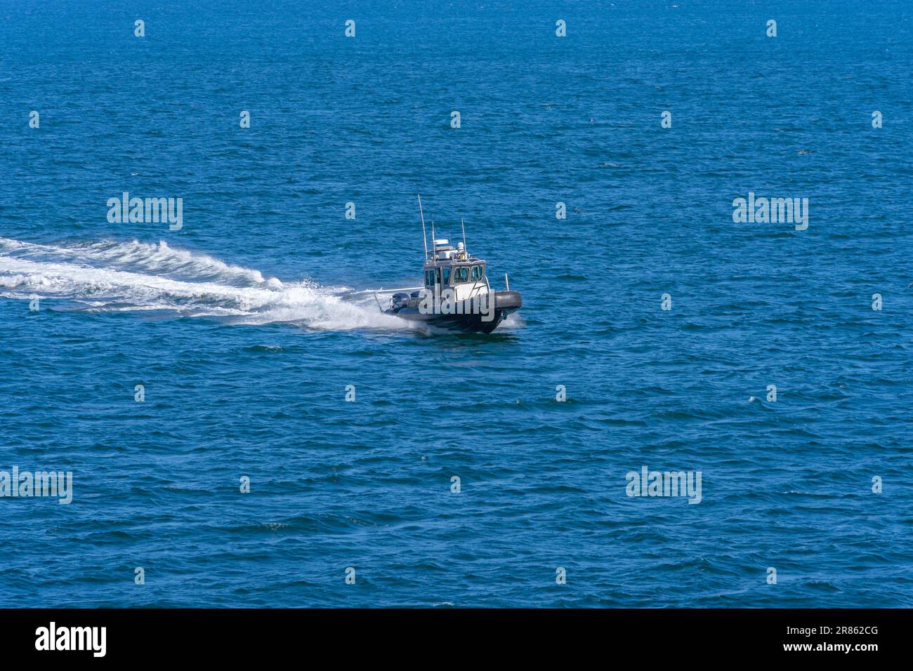 San Pedro, CA, USA – June 2, 2023: A Los Angeles Port Police boat speeds on the water at the Port of Los Angeles in San Pedro, California. Stock Photo