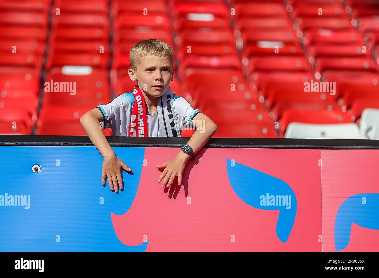 Manchester, UK. 19th June, 2023. A young England supporter takes in the atmosphere*** during the 2024 UEFA EURO Qualifiers match between England and North Macedonia at Old Trafford, Manchester, England on 19 June 2023. Photo by Simon Hall. Editorial use only, license required for commercial use. No use in betting, games or a single club/league/player publications. Credit: UK Sports Pics Ltd/Alamy Live News Stock Photo