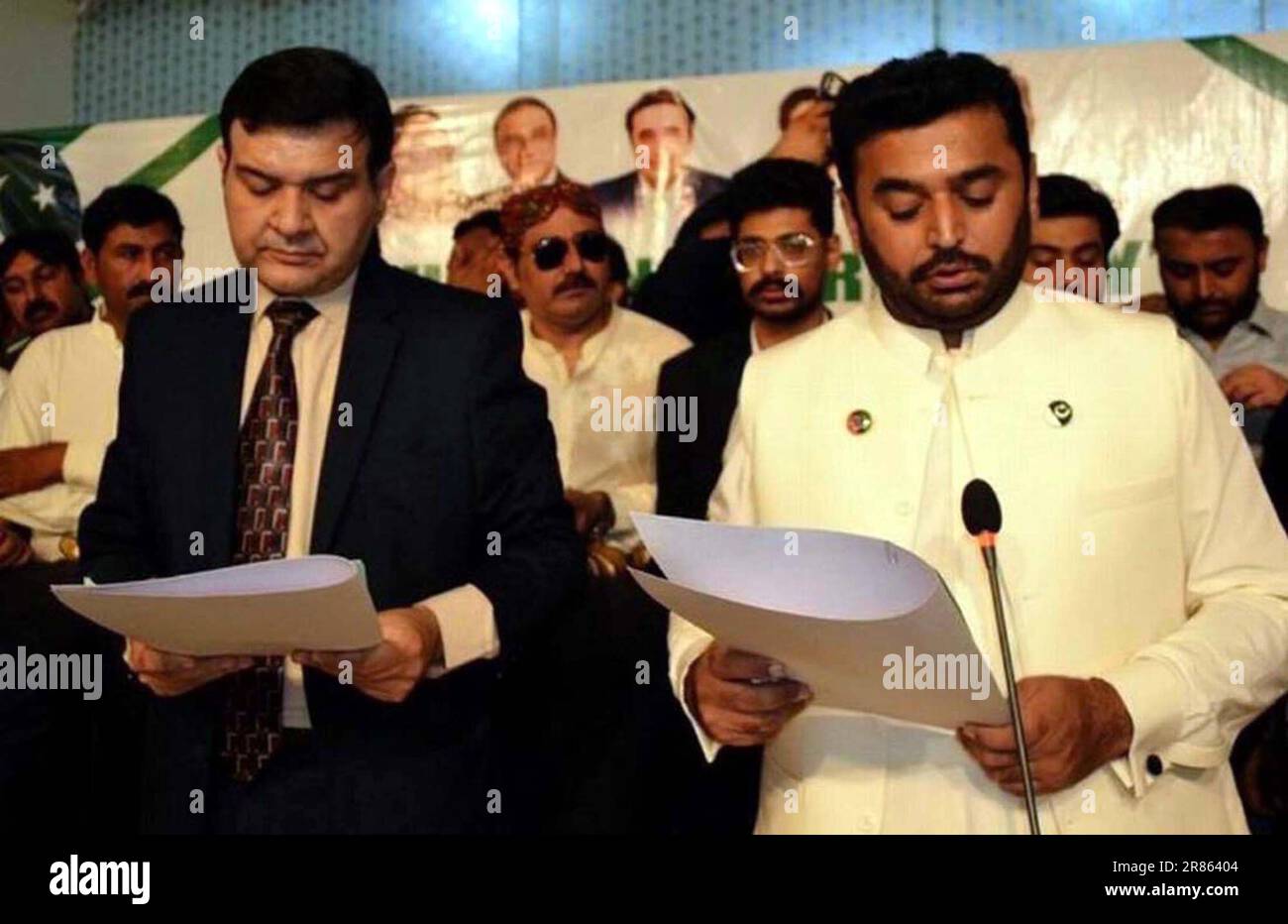 Divisional Commissioner, Bilal Ahmed Memon administrates oath of newly elected Mayor, Kashif Ali Shoro and Deputy Mayor, Saghir Ahmed Qureshi during oath taking ceremony held in Hyderabad on Monday, June 19, 2023. Stock Photo