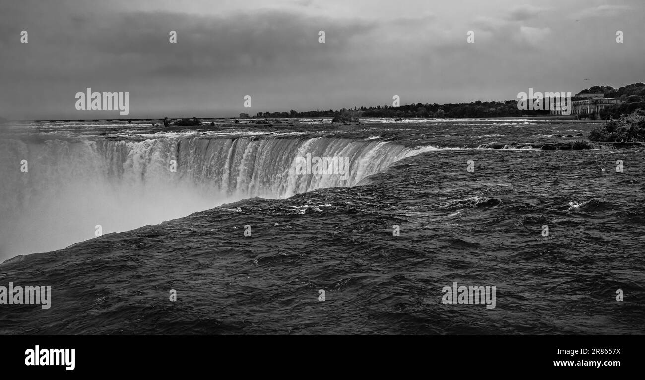 The view of the Niagara Falls, Ontario, Canada. Water fall during summer. Tourist observing Niagara Falls. Travel photo, Nobody, copy space for text. Stock Photo