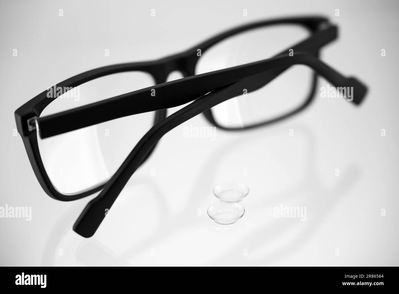 The choice between glasses and contact lenses black and white Stock ...
