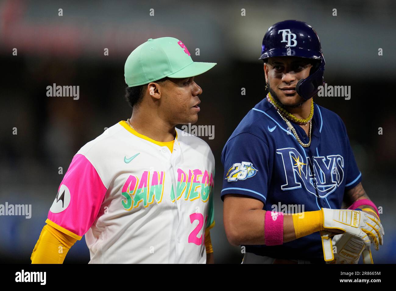 Tampa Bay Rays' Jose Siri jokes with San Diego Padres left fielder Juan