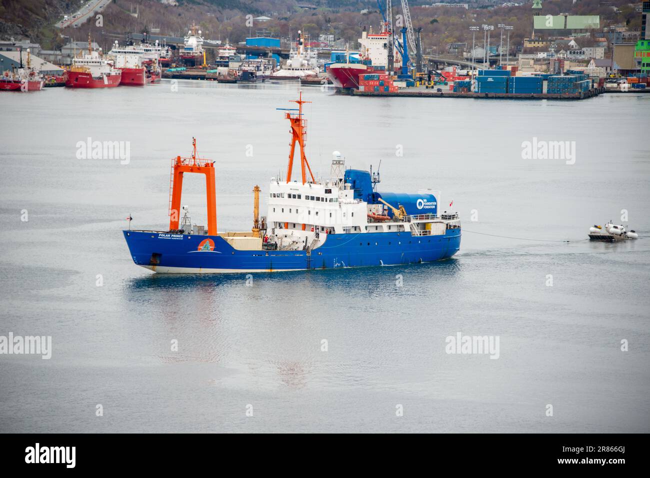 St. John's, Newfoundland, Canada- OceanGate, Polar Prince towing Titan Titanic Expeditions submersible vessels on a barge for a tour of the Titanic. Stock Photo