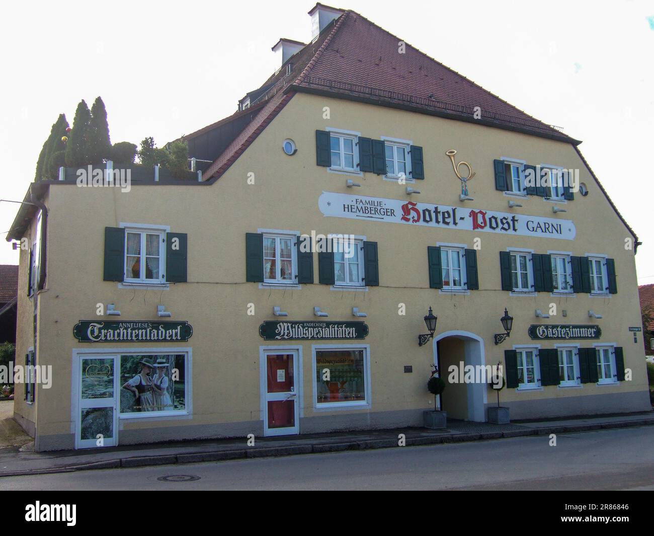 Erling (Andechs), Bavaria, Germany: 19 October 2010: The building of the Hotel zur Post Garni with small game store and traditional costume store Stock Photo