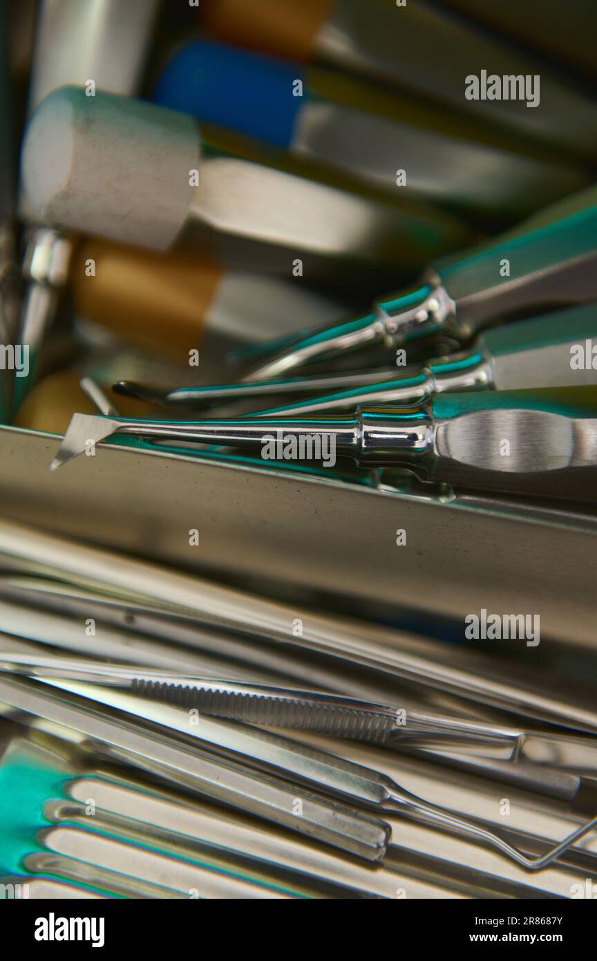 Closeup professional stainless steel dental instruments and accessories inside an ultraviolet