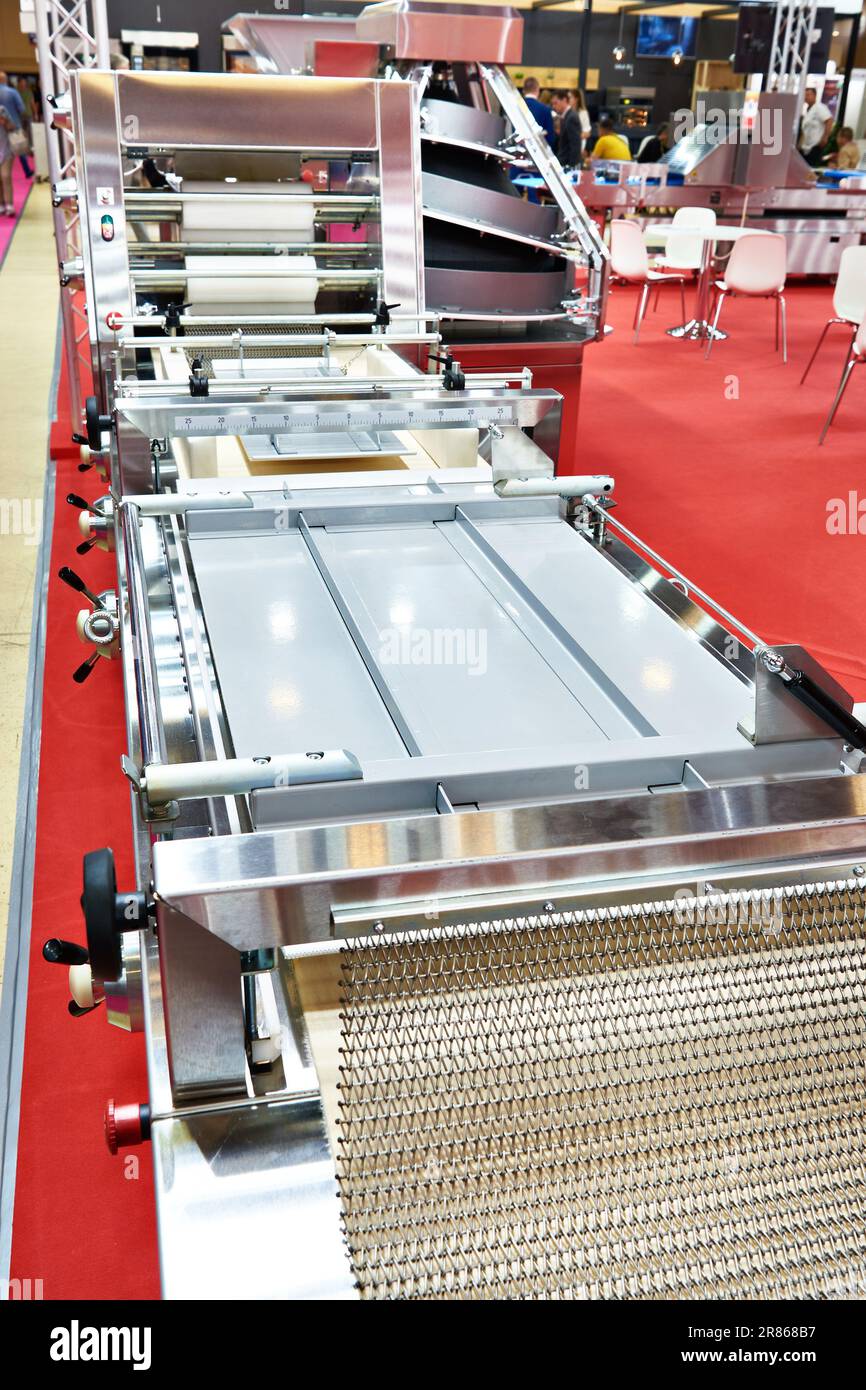 Dough-rolling machine at the exhibition Stock Photo