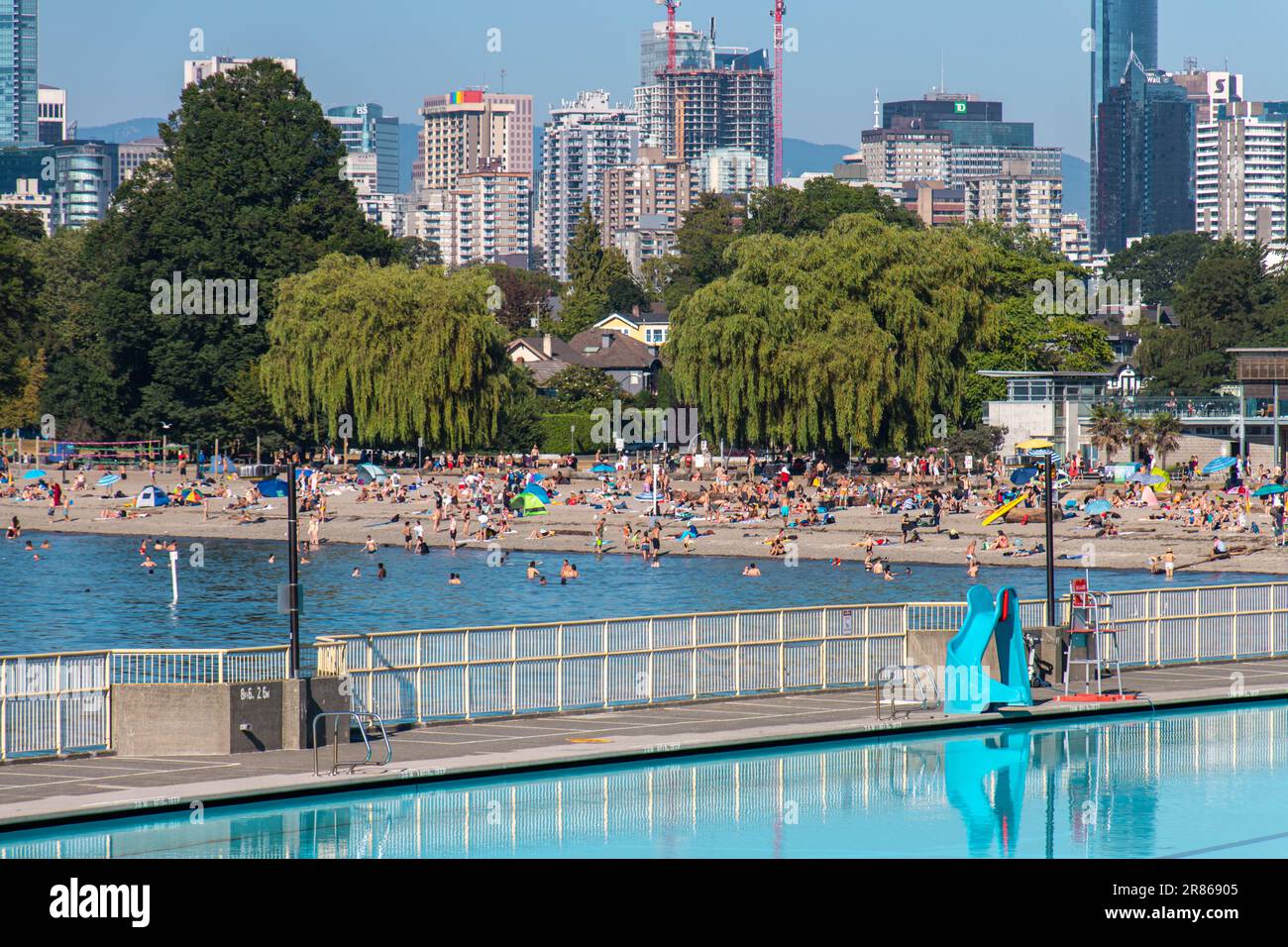 English Bay from Kitsilano Beach and Pool in a sunny day. English Bay Beach (also called as First Beach) is an open bay of the Burrard Peninsula, BC Stock Photo