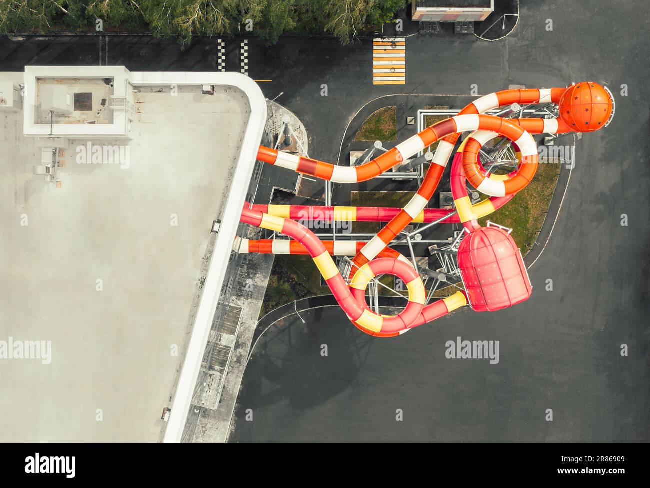 Aerial top down view of colorful winding slides of an attraction in