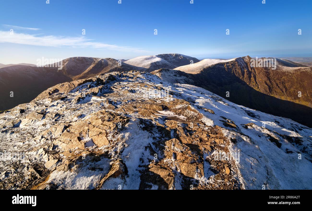The summit of Grisedale Pike with Crag Hill, Grasmoor and Hopegill Head in the distance in winter in the English Lake District, UK. Stock Photo