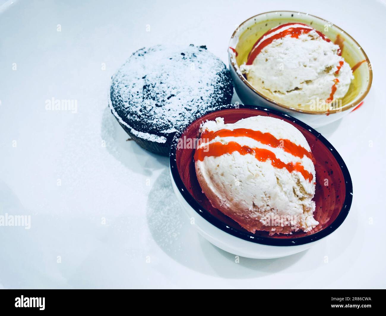 Three bowls with ice cream served in a restaurant Stock Photo Alamy