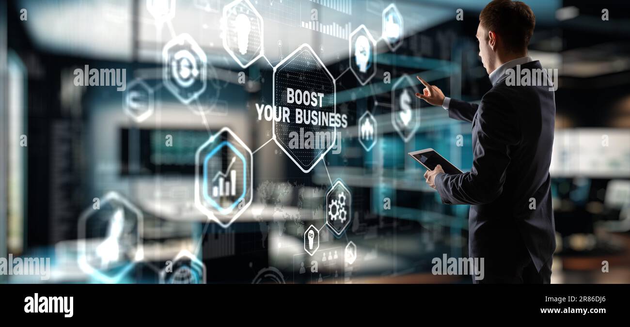 Boost Your Business 2023. Businessman touching finger virtual screen Stock Photo