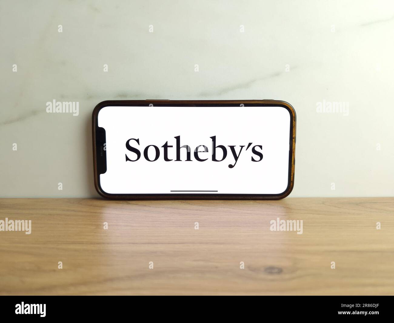 Konskie, Poland - June 17, 2023: Sothebys auction house logo displayed on mobile phone screen Stock Photo