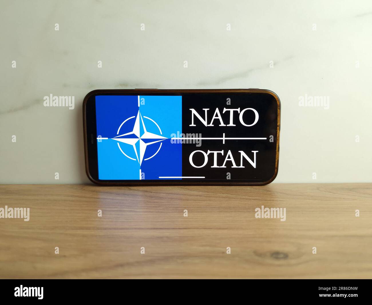 Konskie, Poland - June 17, 2023: NATO North Atlantic Treaty Organization logo displayed on mobile phone screen Stock Photo