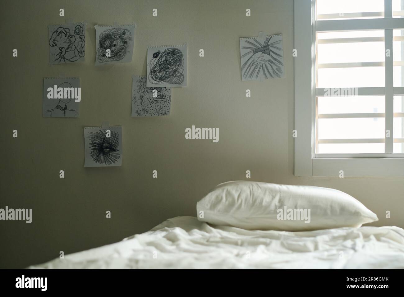 Interior of ward of mental hospital with group of pictures drawn by