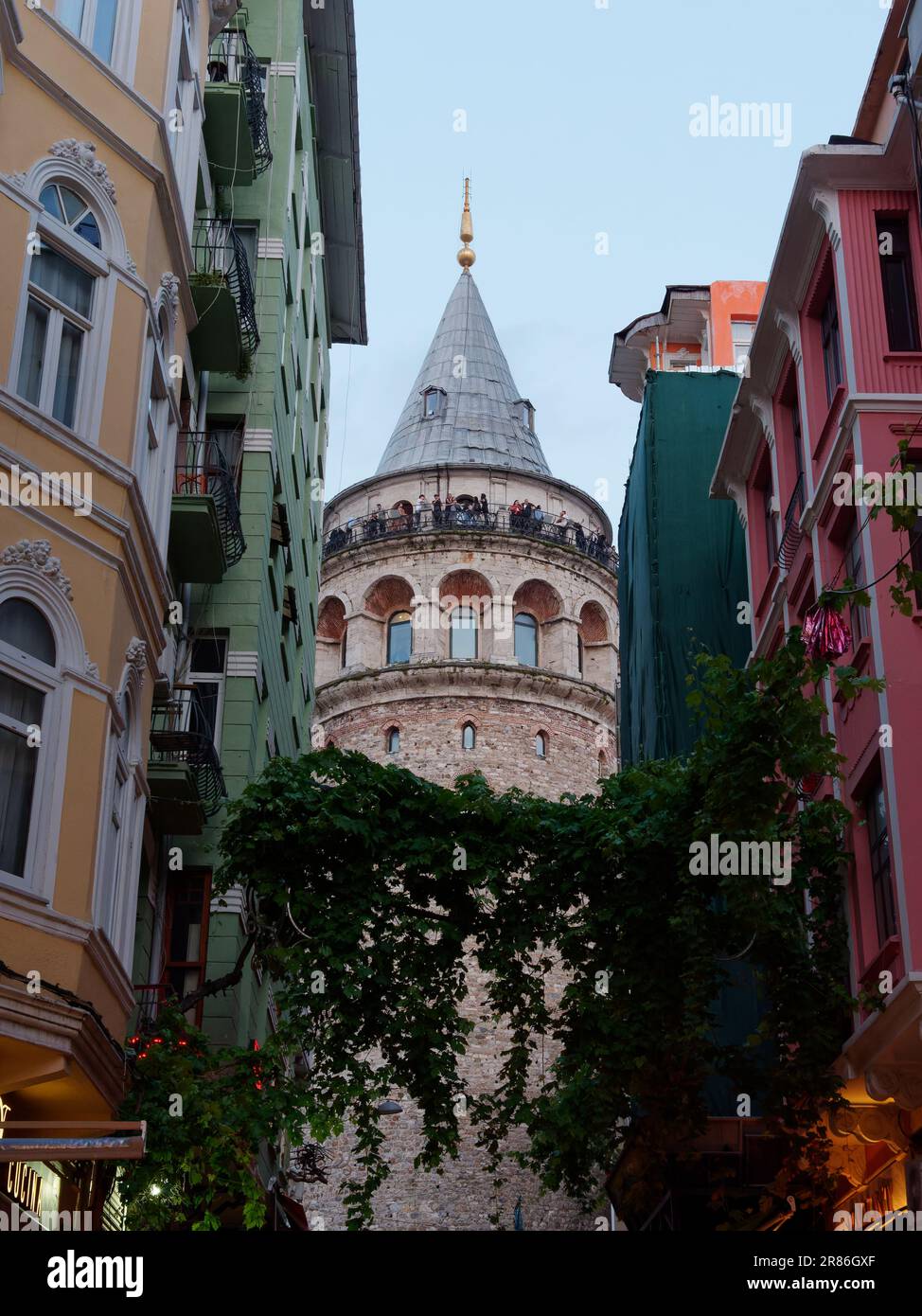 Galata Tower and surrounding buildings in the evening in Istanbul, Turkey Stock Photo