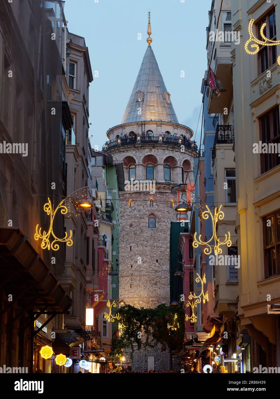 People enjoying the view from the Galata Tower in the evening in Istanbul, Turkey Stock Photo