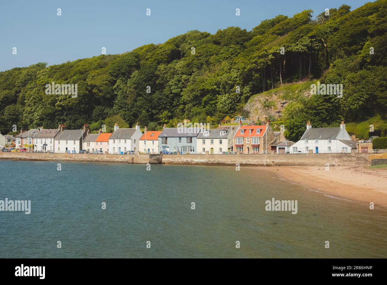 A colourful row of waterfront homes on a sunny summer day at the