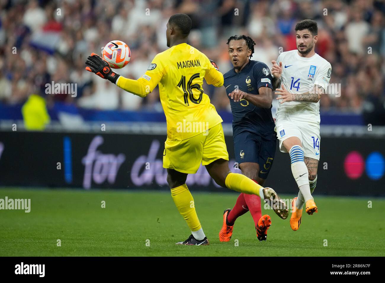 France goalkeeper Mike Maignan, left, and Jules Kounde, centre