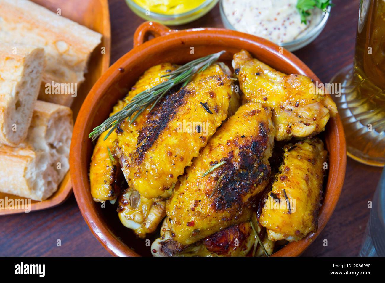 Fried chicken wings in clay pottery Stock Photo Alamy