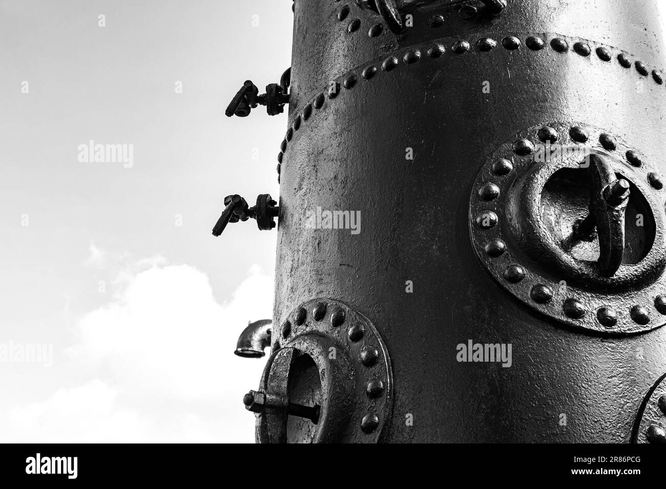 Antique cast-iron waterworks with taps and valves. Part of the city water supply system in the 19th century. Water supply. Stock Photo