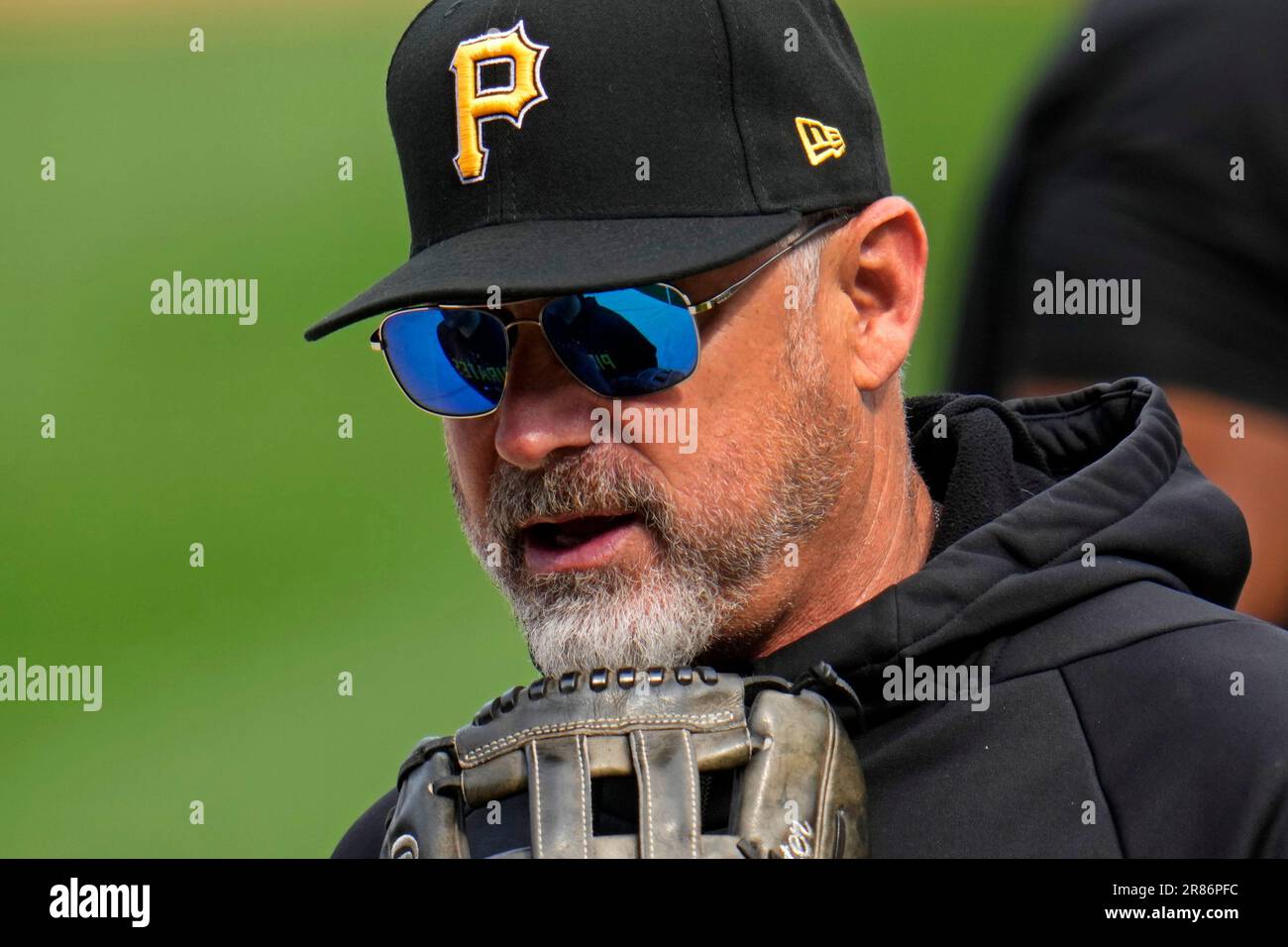 Pittsburgh Pirates' Derek Shelton hands around the batting cage before