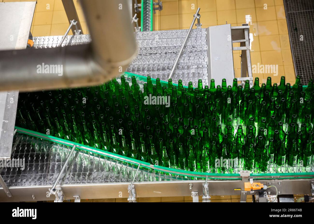 Bottles of beer on bottling line Stock Photo