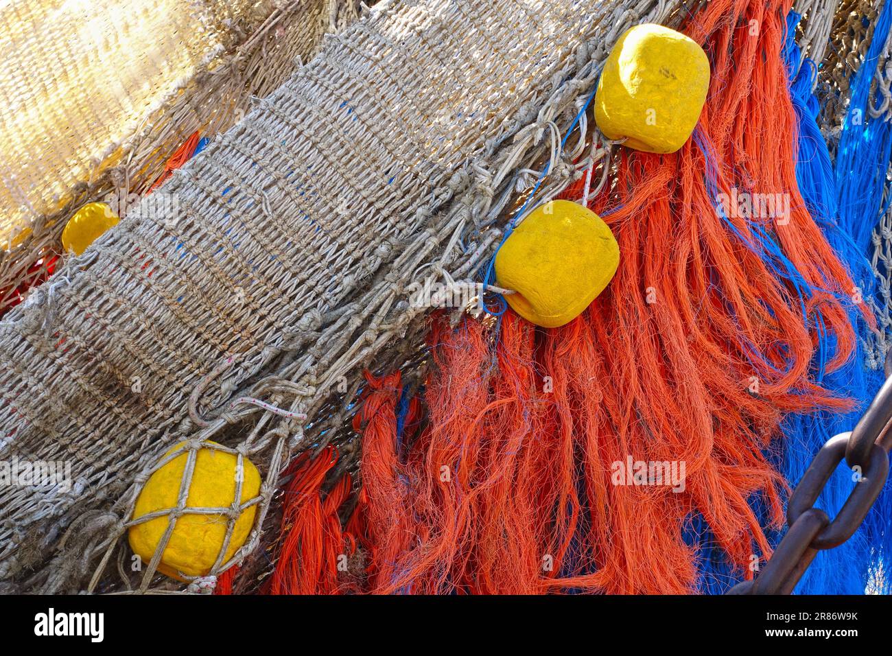 Close-up of a trawler fishing net with tassels and floats Stock Photo