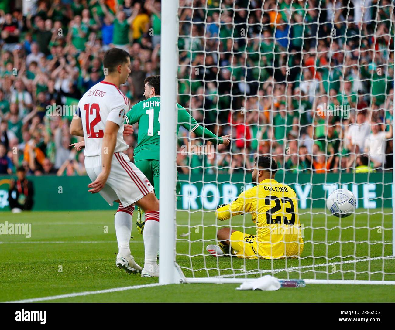 Dublin, Ireland. 19th June 2023; Aviva Stadium, Dublin, Ireland: International Football Group B Euro 2024 Qualifier, Republic of Ireland versus Gibraltar; Mikey Johnston of Ireland gets the ball past Dayle Coleing of Gibraltar to score the opening goal for 1 - 0 in the 52nd minute Credit: Action Plus Sports Images/Alamy Live News Stock Photo