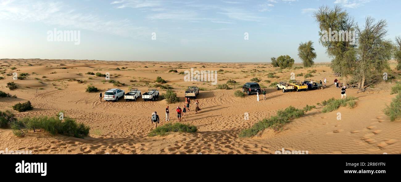 Tourists on desert safari Dubai, UAE Stock Photo