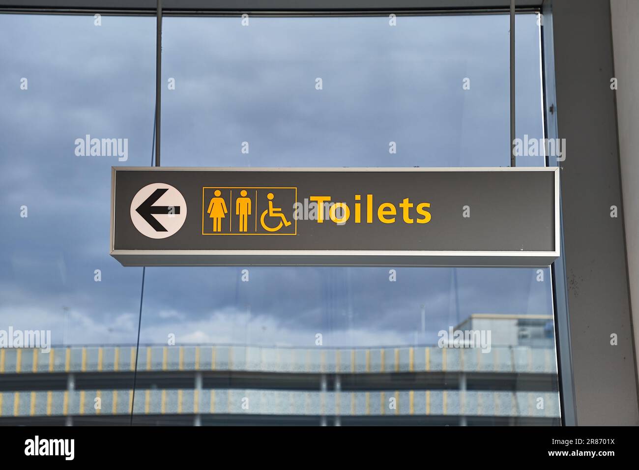 Toilet signs showing direction Stock Photo Alamy