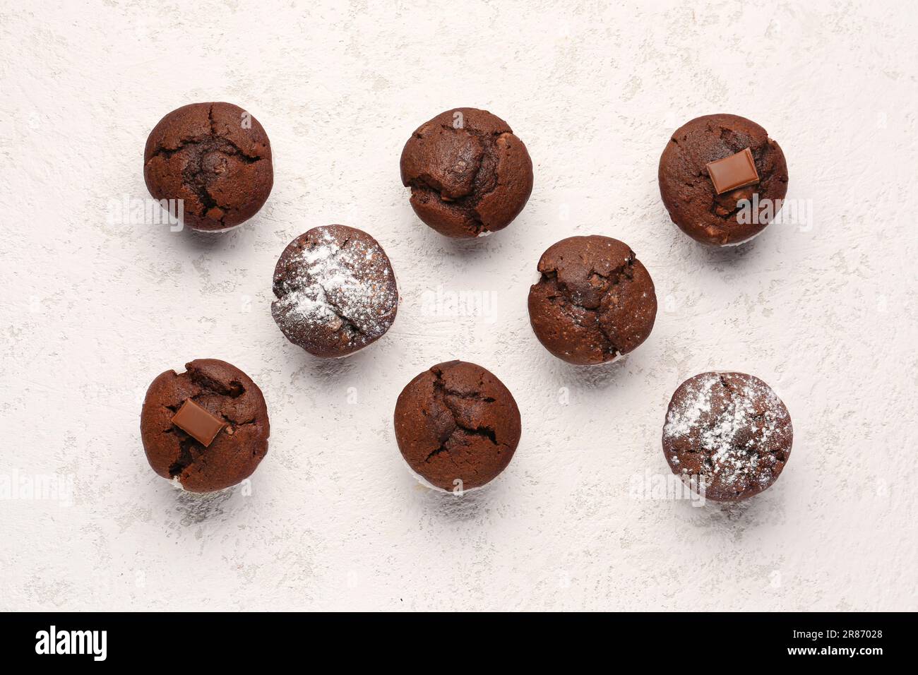 Tasty chocolate cupcakes on light background Stock Photo