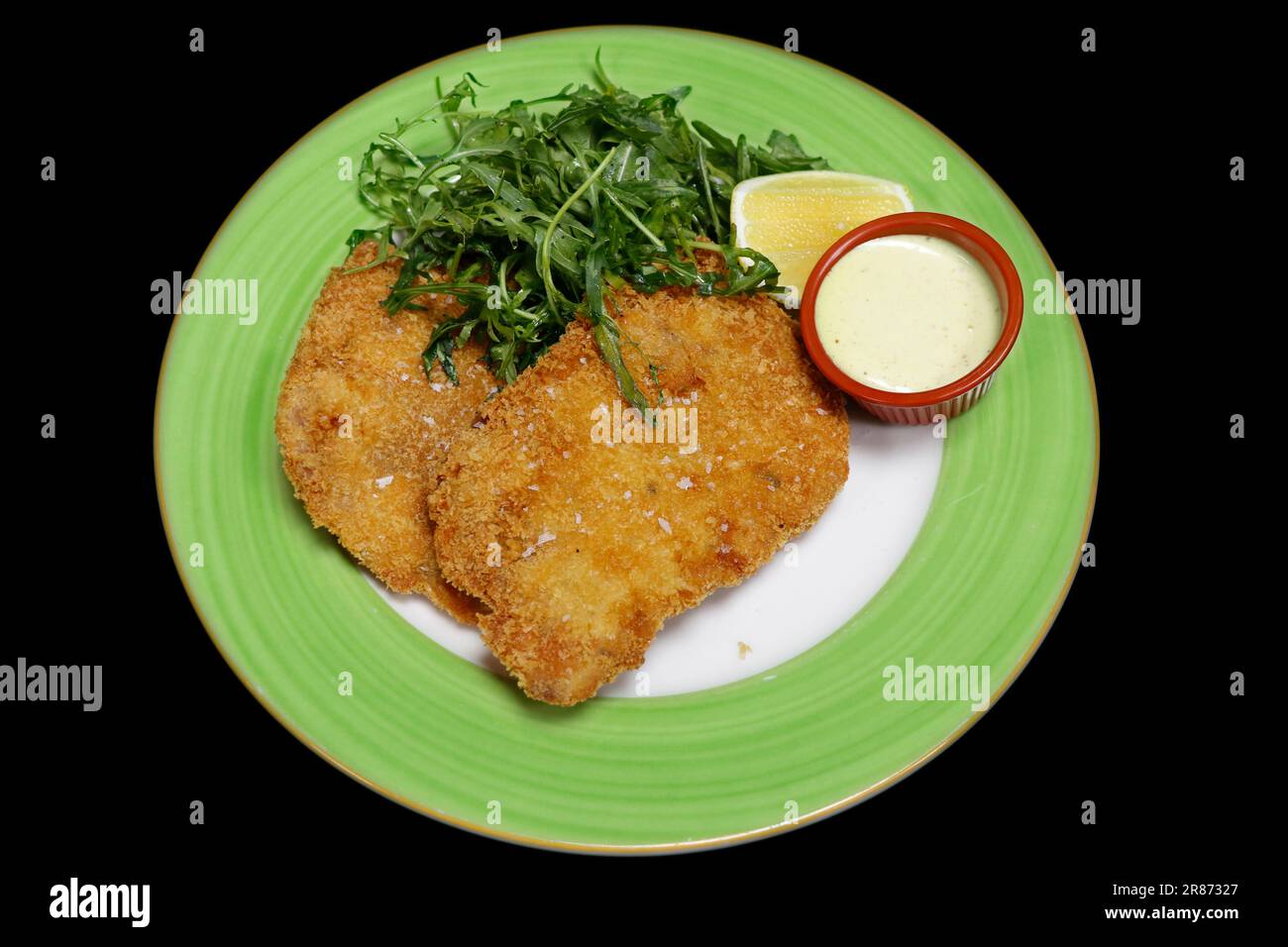 breaded deep fried pork tenderloin known as schnitzel or escalope with