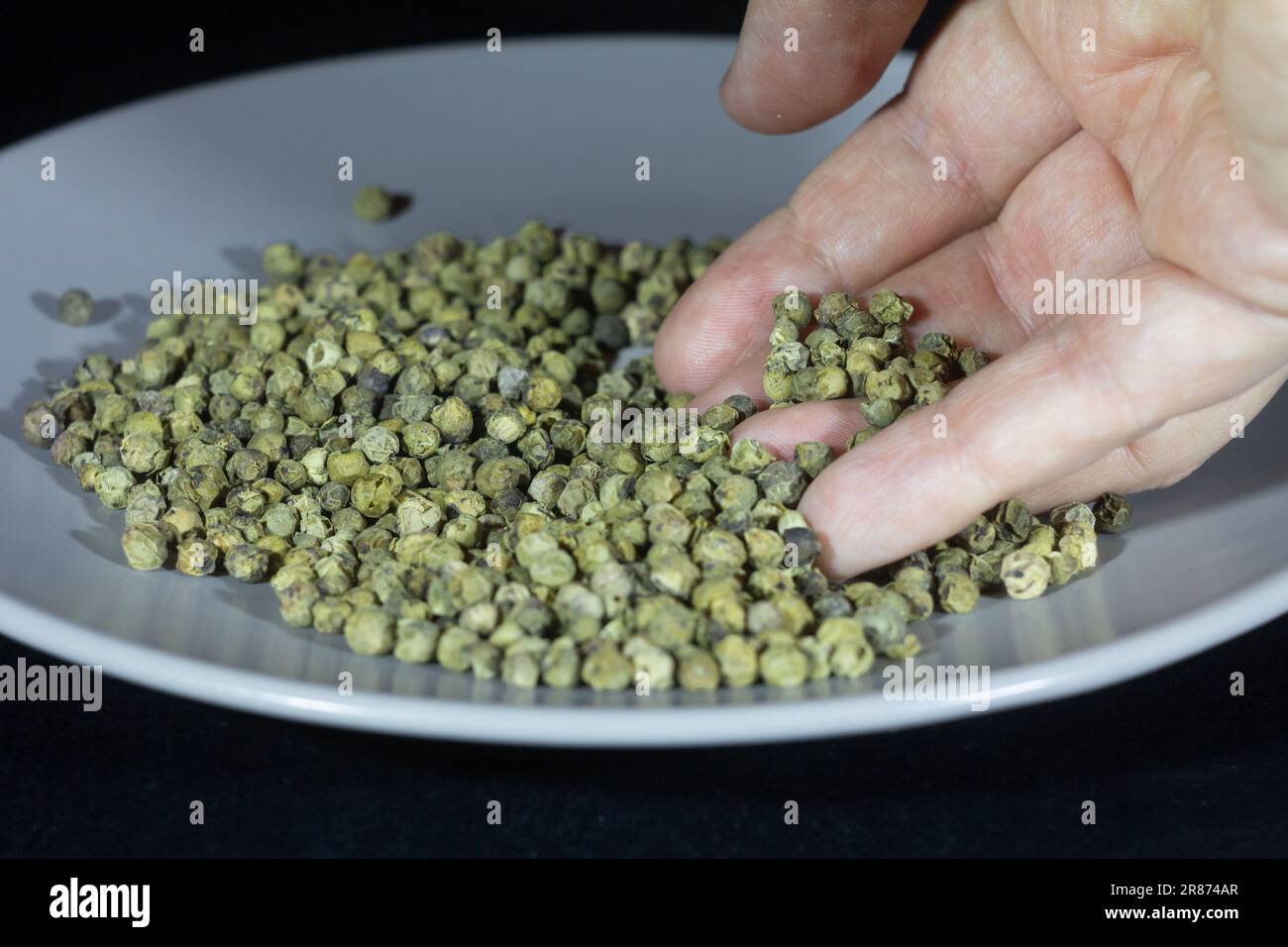 Hands holding green peppercorn hires stock photography and images Alamy