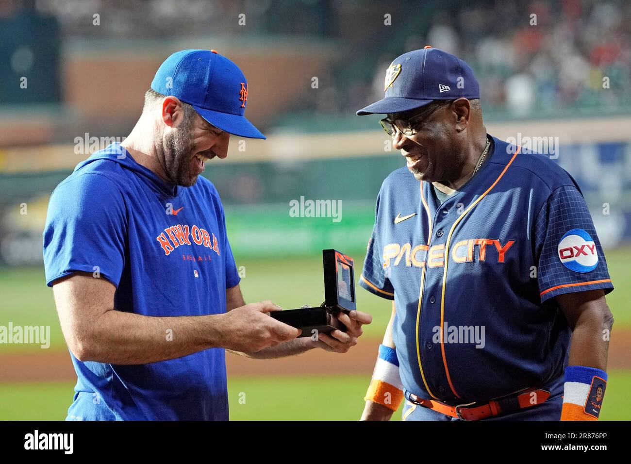 Houston Astros manager Dusty Baker Jr., right, presents New York Mets  pitcher Justin Verlander his 2022 World Series Championship ring before a  baseball game Monday, June 19, 2023, in Houston. (AP Photo/David