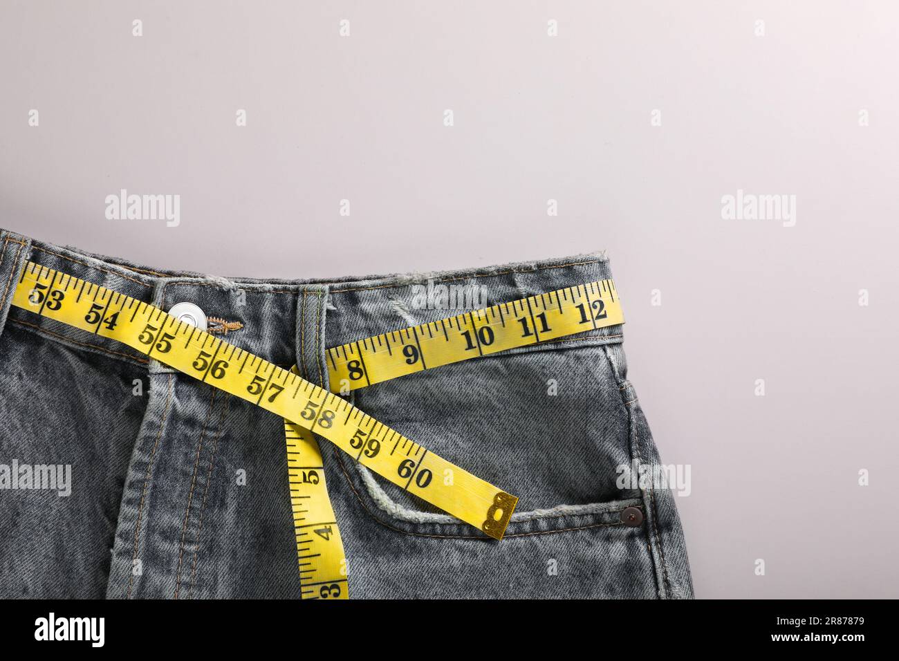 Woman grabbing skin on her flanks with black color crosses marking, Lose  weight and liposuction cellulite removal concept, Isolated on white  backgroun Stock Photo - Alamy