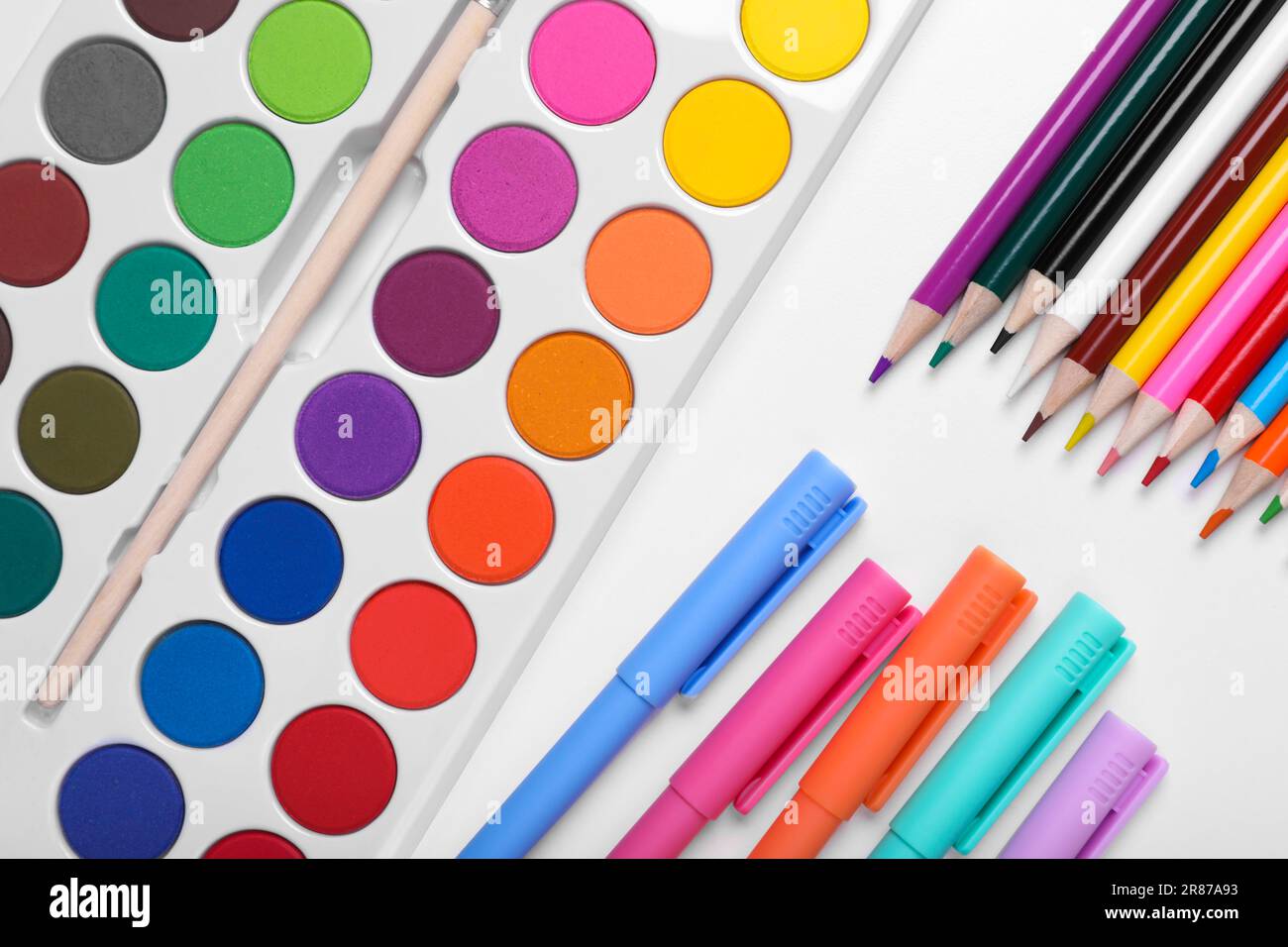 Many colorful markers on white background. School stationery Stock Photo -  Alamy