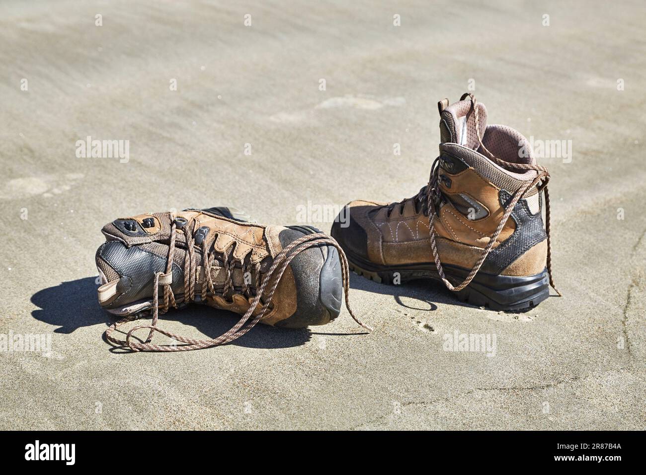 Boots taken off in the sand Stock Photo Alamy