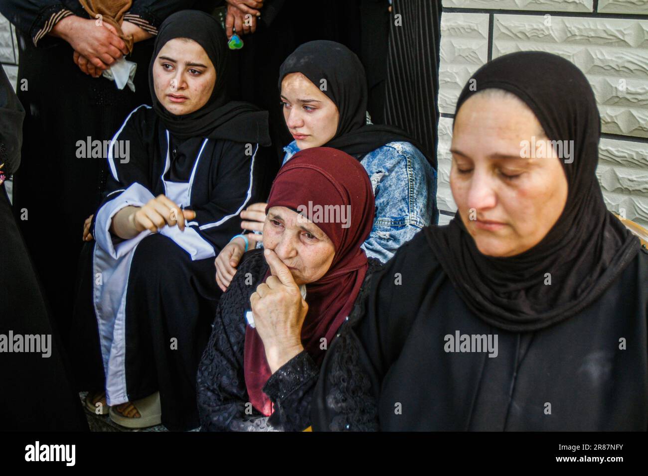 Jenin, Palestine. 19th June, 2023. Relatives mourn during the funeral of one of the five Palestinians who were killed in a bloody raid at Jenin refugee camp in the northern West Bank. Israeli army forces killed 5 Palestinians, including a child, during a ten-hour raid on Jenin refugee camp, near the city of Jenin, in which helicopters and dozens of armored military vehicles were used. seven Israeli soldiers were wounded during this raid. Credit: SOPA Images Limited/Alamy Live News Stock Photo