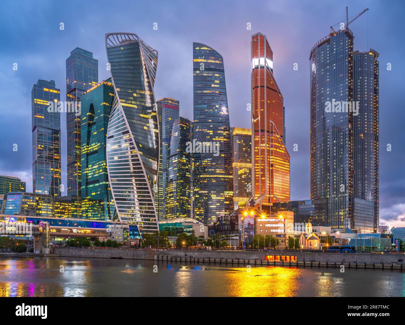 High buildings of Moscow-City at Moskva River at summer sunset, Russia. Moscow-City is business district in Moscow. Panorama of modern office building Stock Photo