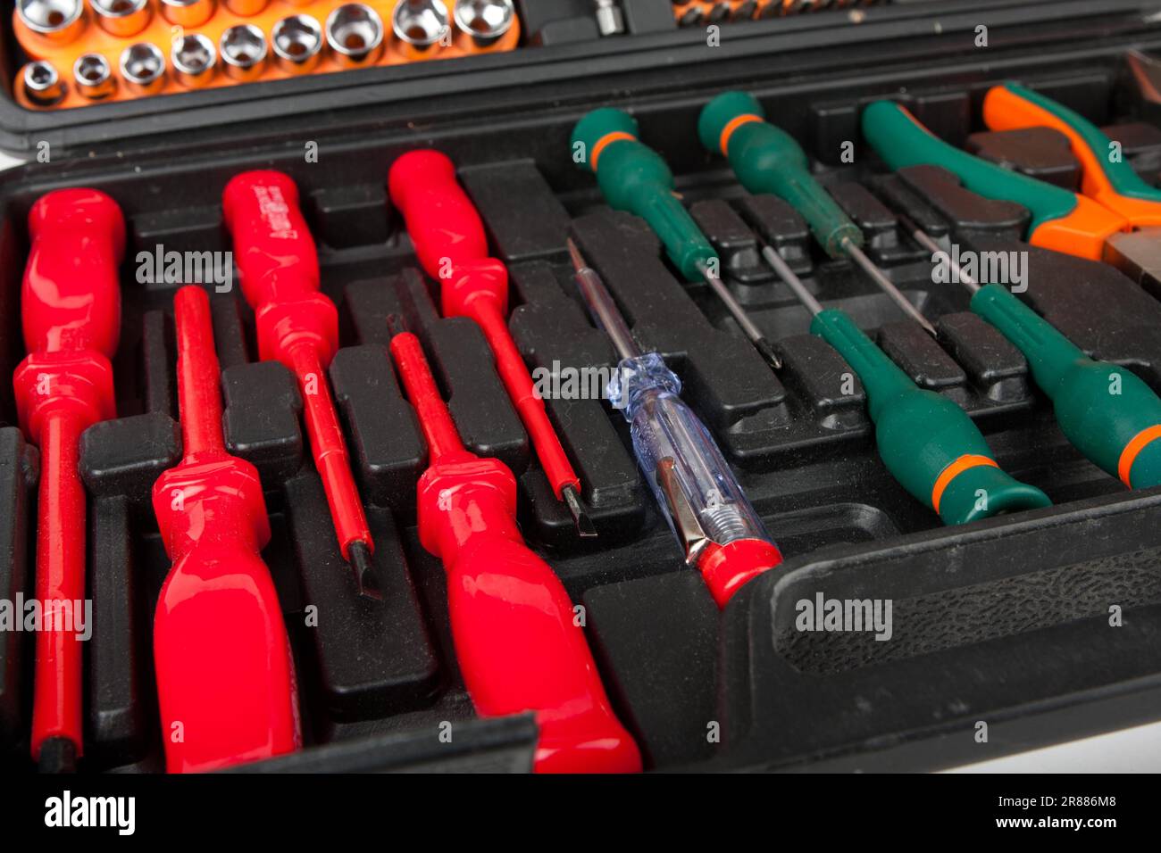 Set of screwdrivers and other tools in black box Stock Photo