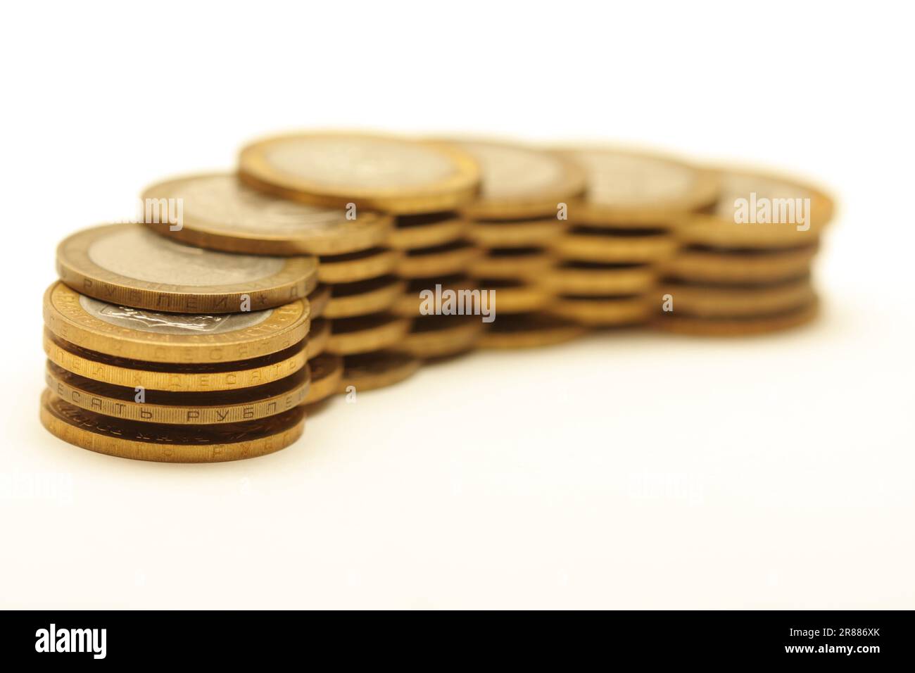 Bunch of golden coins isolated on white background Stock Photo - Alamy