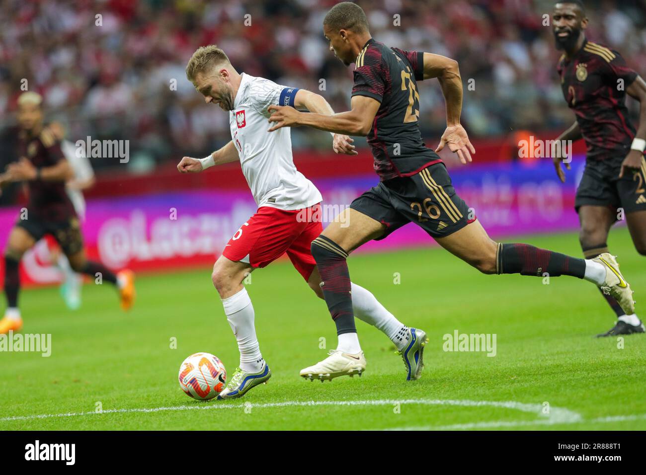 Warsaw, Poland. 16th June, 2023. Jakub Blaszczykowski of Poland (L) and Malick Thiaw of Germany (R) in action during the Friendly match between Poland and Germany at PEG Narodowy. Final score: Poland 1:0 Germany. Credit: SOPA Images Limited/Alamy Live News Stock Photo