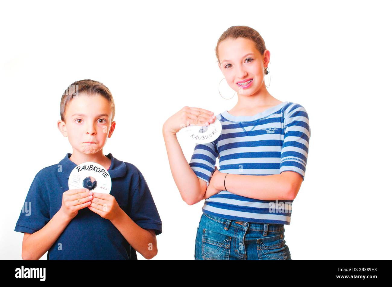 Boy and girl with CD-Rom, pirate copy Stock Photo