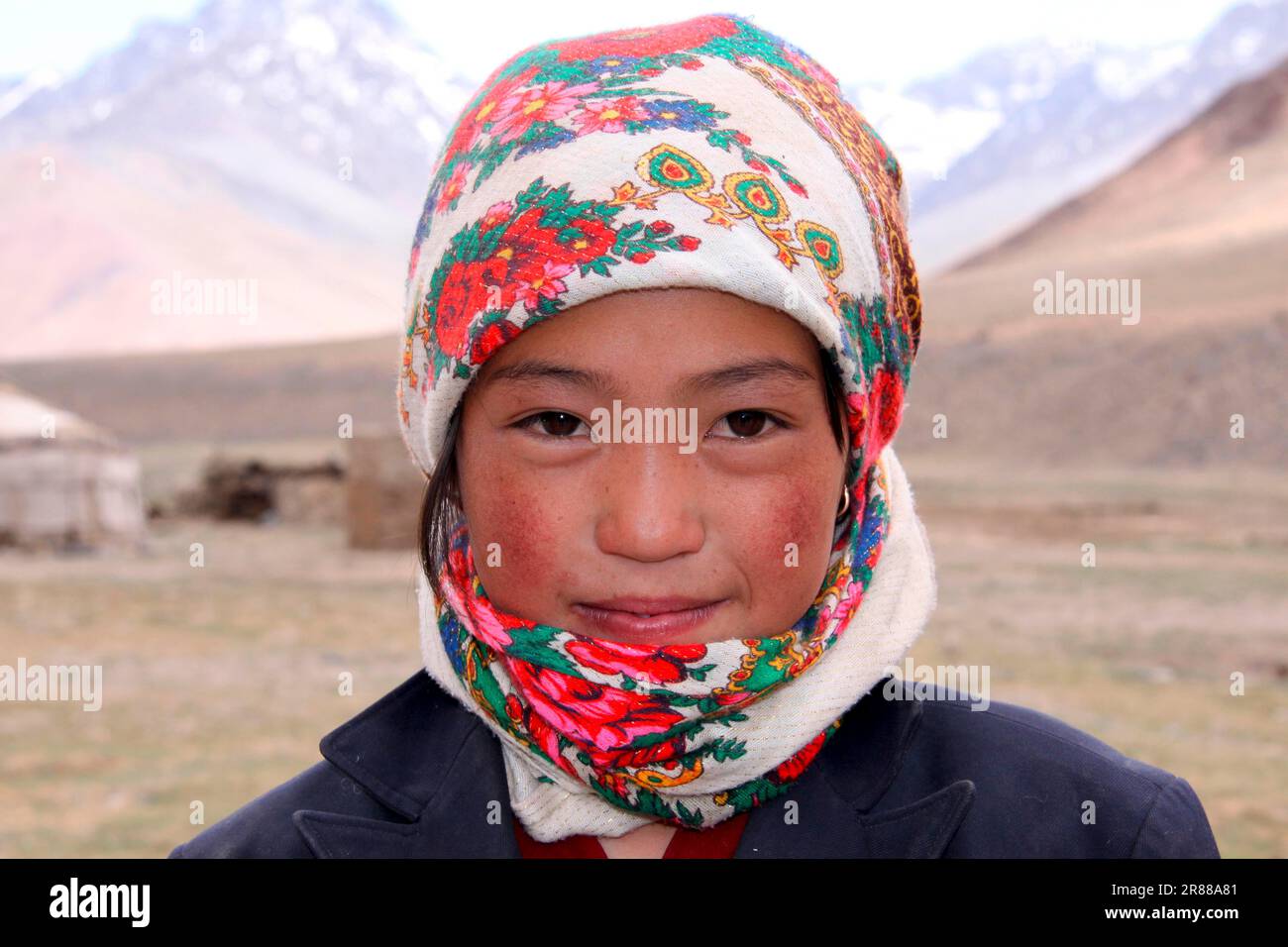 Kyrgyz shepherd girl in the mountains near Murgab Tajikistan Stock Photo