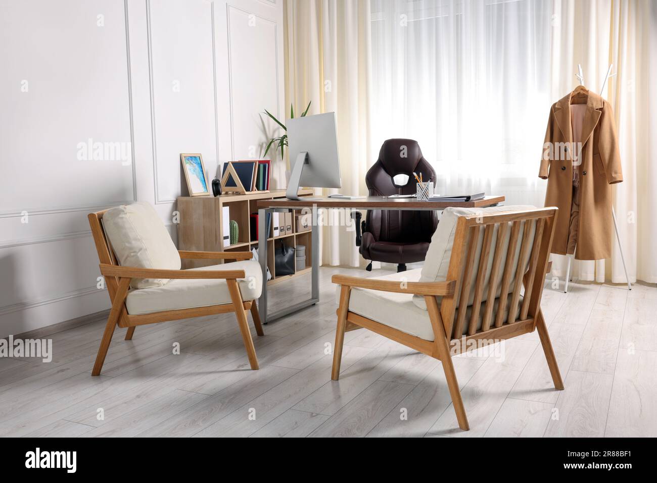 Receptionist workplace with computer and waiting area. Interior design ...
