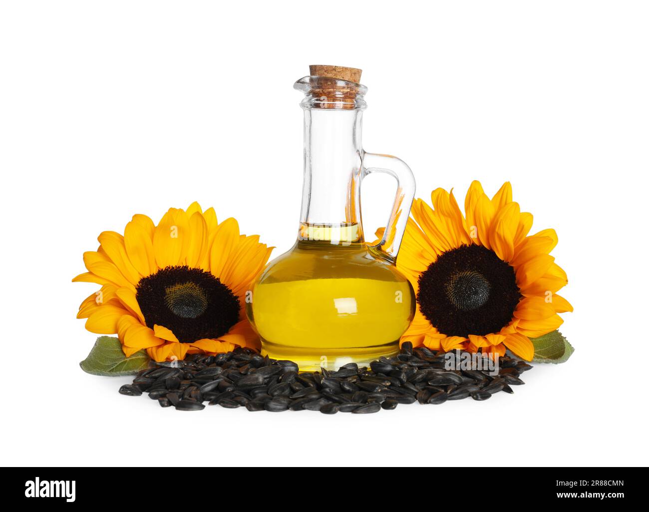 Sunflower cooking oil, seeds and yellow flowers on white background